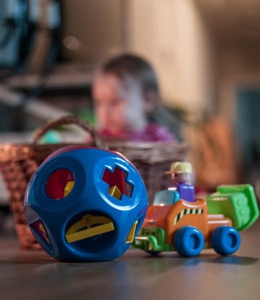 close-up-multi-colored-toys-floor-against-baby-wicker-basket_1048944-5439188 (1)